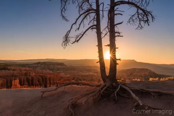 Cramer Imaging's fine art landscape photograph of the sun rising over Bryce Canyon National Park Utah on the summer solstice