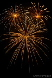 Cramer Imaging's fine art photograph of three fireworks in the night sky on the 4th of July