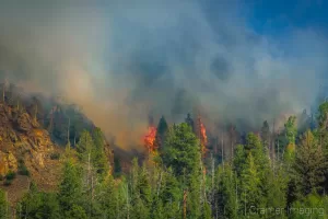 Cramer Imaging's landscape photograph of a two wildfire flare ups near Panguitch Lake Utah