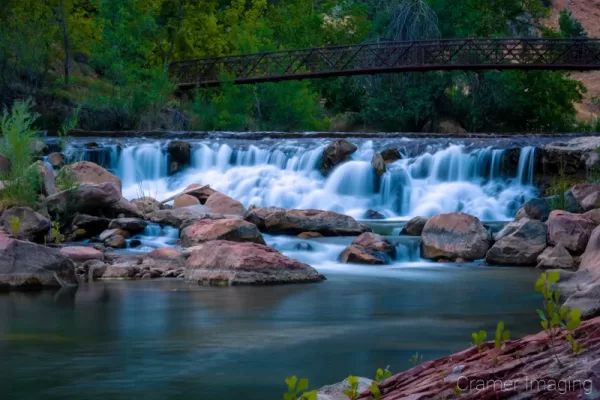 Cramer Imaging's fine art landscape photograph of a waterfall and bridge on the Virgin River in Zion National Park Utah