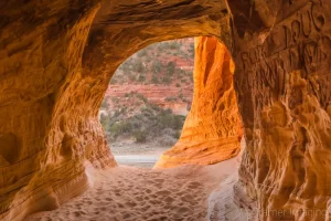 Cramer Imaging's fine art landscape photograph of graffiti carved into the walls of the Moqui sand caverns cave entrance