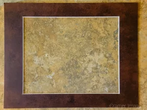 photo of a single brown picture mat sitting on a table