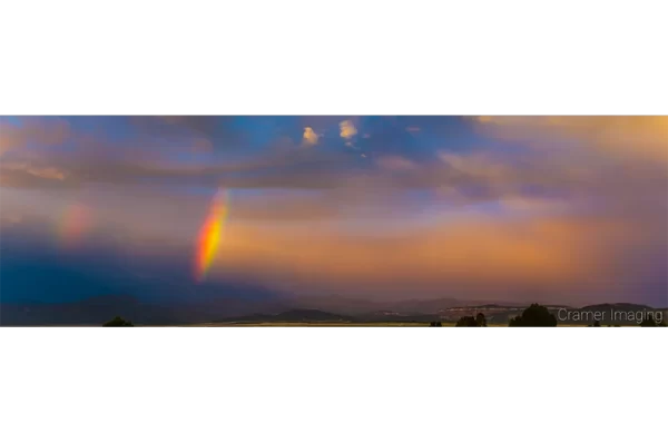Cramer Imaging's fine art landscape photograph of a double rainbow arc against a dramatic sunset sky in Panguitch, Utah