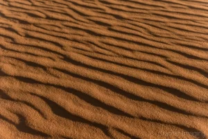 Cramer Imaging's fine art nature photograph of waves and shadows in the sand dunes