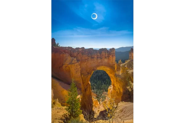 Cramer Imaging's fine art landscape photograph of an annular eclipse or ring of fire over Bryce Canyon's Natural Bridge formation