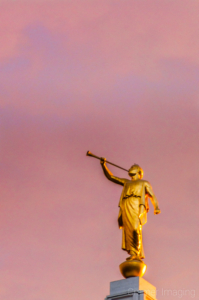 Cramer Imaging's fine art minimalism photograph of the Angel Moroni statue sitting atop a spire with s pink sunset background