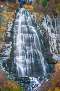 Cramer Imaging's fine art landscape photograph of Bridal Veil Falls Utah surrounded by ice and fall or autumn colors