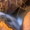 Cramer Imaging's fine art landscape photograph looking down on Kanarra Falls near Kanarraville Utah with silky water and the ladder