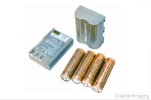 Photograph of three different kinds of camera batteries as done by Cramer Imaging