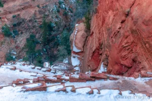 Cramer Imaging's fine art landscape photograph looking down on a snowy Walter's Wiggles in Zion National Park Utah