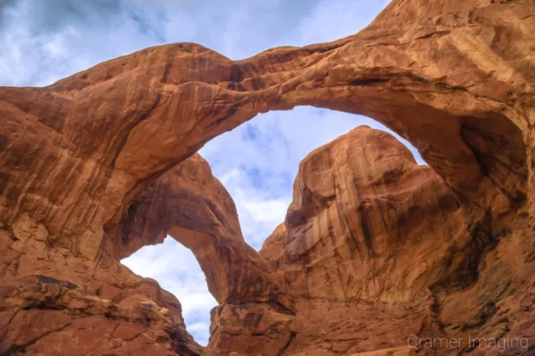 Cramer Imaging's fine art landscape photograph of the Double Arch against the sky at Arches National Park, Utah