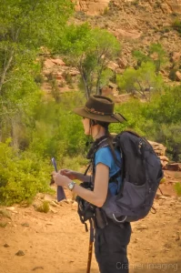 Landscape photographer Audrey Cramer considering the sights on a hike