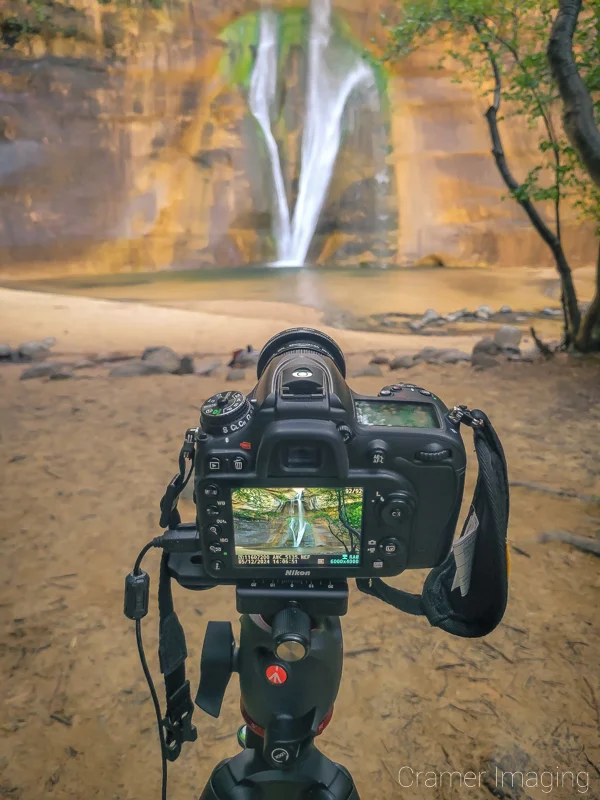 Cramer Imaging's photograph of a camera on a tripod taking a picture of Lower Calf Creek Falls in Escalante National Monument, Utah