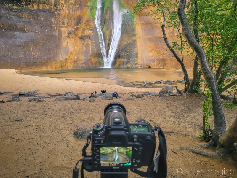 Cramer Imaging's photograph of a camera on a tripod taking a Lower Calf Creek Falls picture at Escalante National Monument, Utah