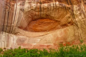 Cramer Imaging's fine art landscape photograph of an eye-shaped formation in a rock wall at Escalante National Monument, Utah