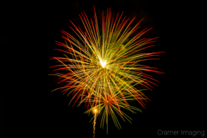 Cramer Imaging's fine art photograph of warm colored fireworks