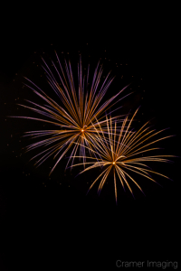 Cramer Imaging's fine art photograph of 2 fireworks exploding in the sky