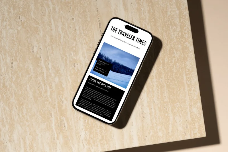 Mockup of a cell phone displaying an email newsletter mockup using an Audrey Cramer Photography image